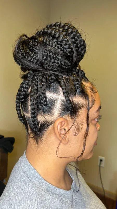 Side view of a Black woman displaying box braids