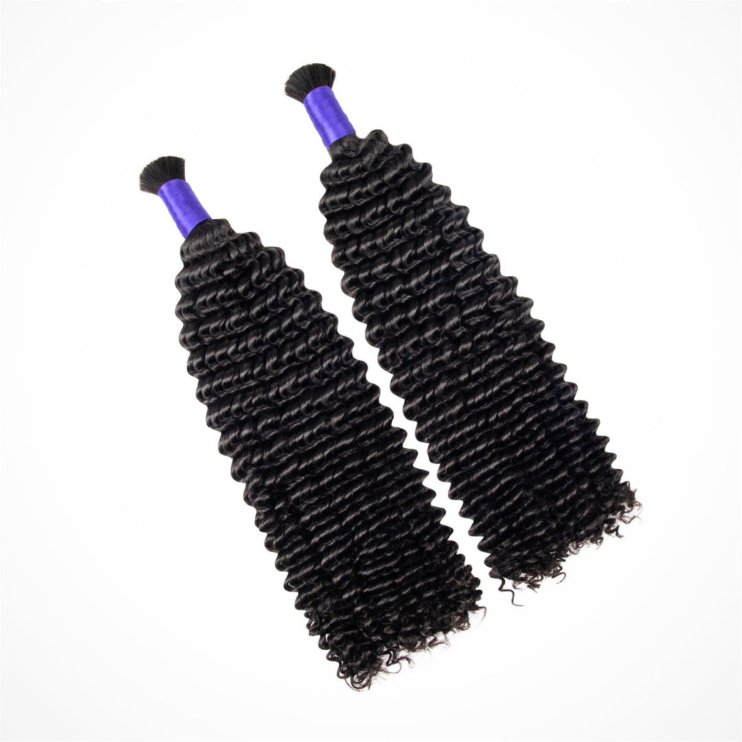 Two braids with kinky curly hair bundles angled towards the top left