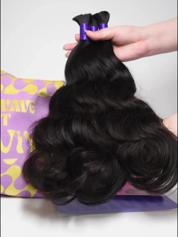 Demonstration video of three body wave human braiding hair bundles held by hands